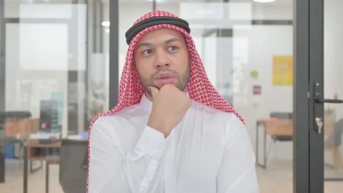 Man in Traditional Dress Has an Idea