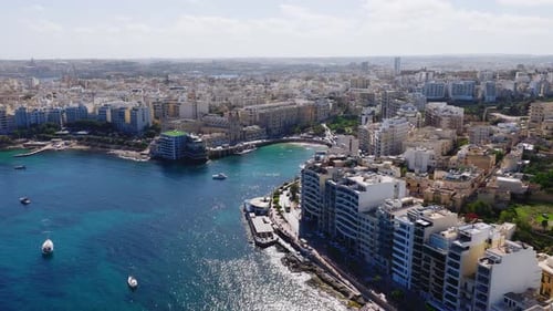 Aerial Sweep of Sliema Waterfront Limestone Blocks and Bay Malta