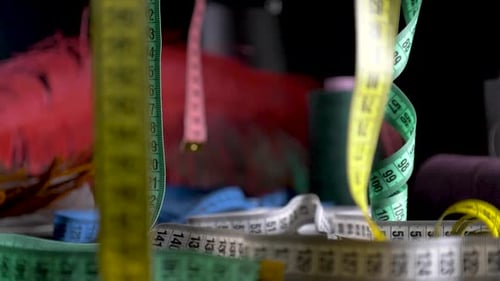 tape measure hang black bacground dolly slide slow motion