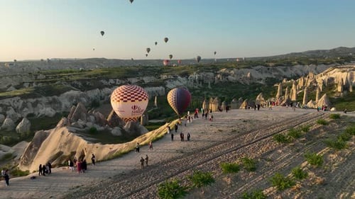 Hot Air Balloons Fly Over the Mountainous Landscape of Cappadocia Turkey