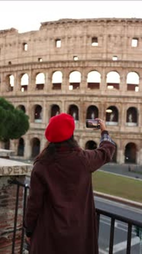 Woman Taking Photo of Colosseum in Rome