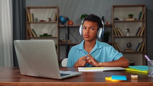 Young African American Child Boy Studying at Home Kid Sits at Desk Attends School Class Online on