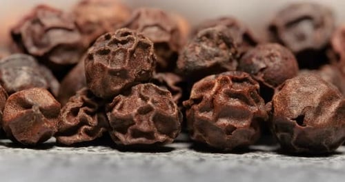 Peppercorns or black pepper spice. Super Macro Close Up.