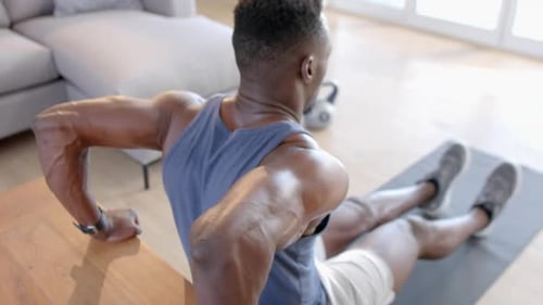 Muscular Man Dips for Tricep Workout at Home