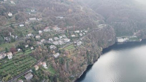 Aerial video over the famous Lake Como in Italy in a snowy winter.
