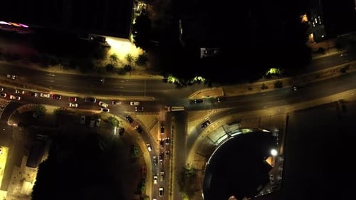 Aerial View of the Cityscape with Evening Traffic on City Roads