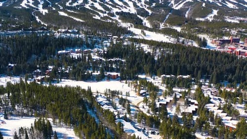 Beautiful Reveal of Ski Slopes in the Rocky Mountains. Many Trails for Winter Sports covered in Thic