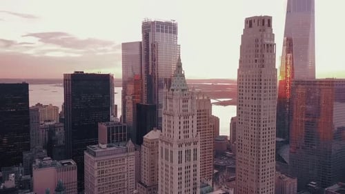 Sunset Cityscape with Diverse Architecture and Waterfront View