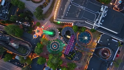 Top-down aerial view of amusement park after dark