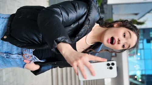 Woman Records Herself on Smartphone in City