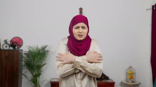 Muslim Woman in Hijab Scarf Feeling Cold
