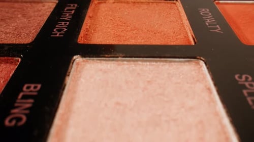 Multi Coloured Rainbow Make Up Palette with Colourful Make Up Brushes Close Up Macro in Shop