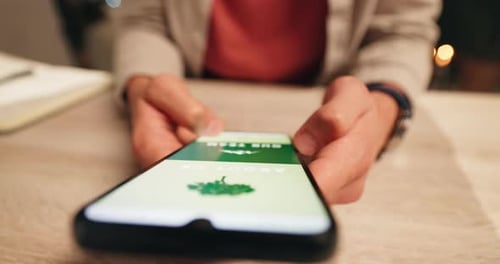 Hands, screen and smartphone on table for scrolling, browsing and mobile application for user
