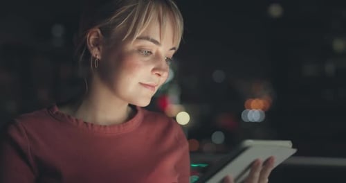 Night, woman and tablet for communication in city
with internet app, social media or email check