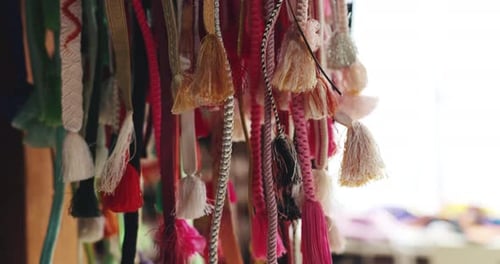 Japan, kimono decoration and obi belt in fabric shop with embroidery pattern and waistband tassel