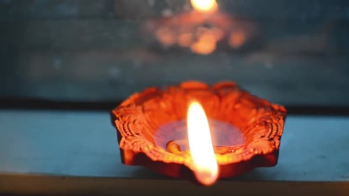 Earthen decorative lamp lit at night on the christmas eve or diwali eve front view