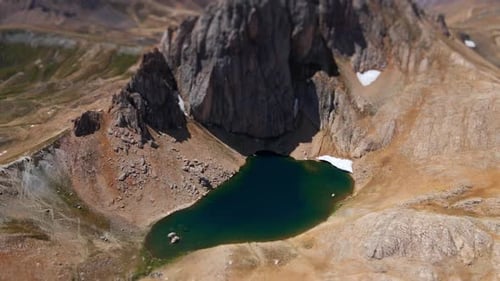 Aerial view mountains and crater lake tilt shift blur effect