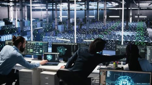 Team Working at Computers in Data Center