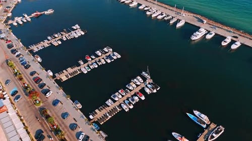 Sunset marina with boats. Numerous boats are docked