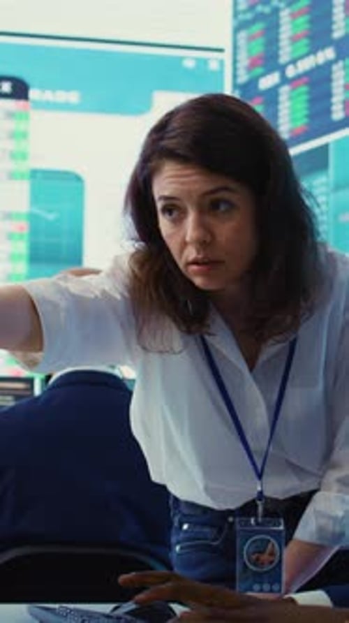 Financial Analysts Reviewing Stock Data on Computer Monitor