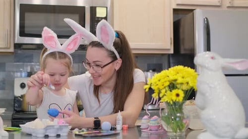 Mother and Daughter Decorate Easter Eggs Together