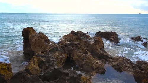 Atlantic Waves Crashing on Jagged Rocky Beach Coastline in Portugal