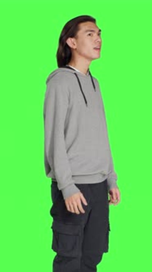 Side View of Adult Having Pleased Reaction in Studio