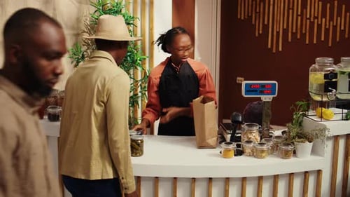 Adults Shopping and Working at Store Counter