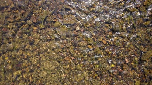Stones at the Bottom of a Mountain River