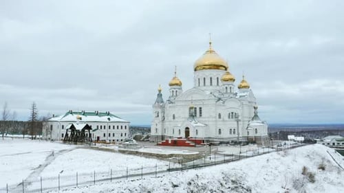 Large white Orthodox church with golden domes