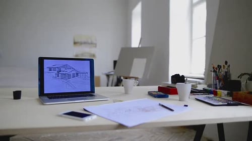 Modern workspace with laptop and smartphone at an office desk