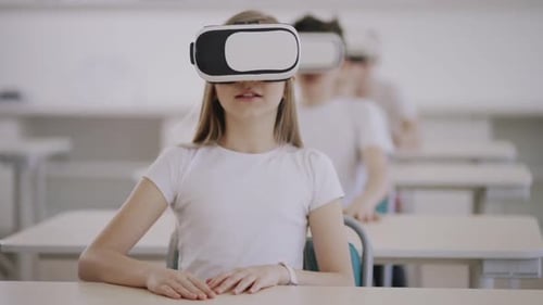 Children Using VR Headsets in School Classroom