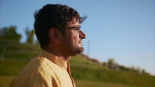 Indian Man Breathing Fresh Air in a Green Field