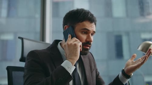 Businessman Talking on Phone in Modern Office