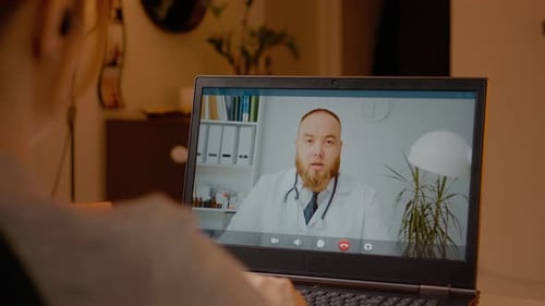 Virtual Doctor Visit with Telehealth Consultation on Laptop