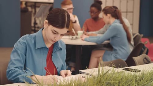 Female University Student Studying in Coworking Space