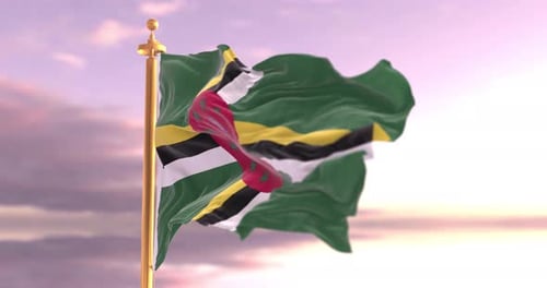 Dominica National Flag Waving on Golden Pole at Sunset