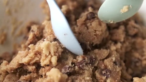Super macro closeup of mixing chocolate chip biscuit dough in bowl