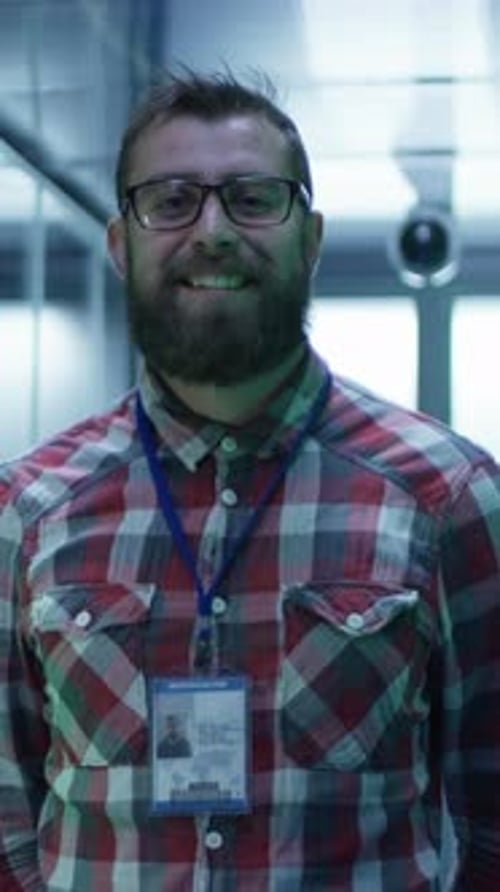 Man with Access Pass Smiling in Server Room