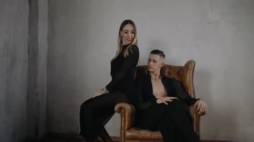 Elegant Woman and Man Posing Indoors