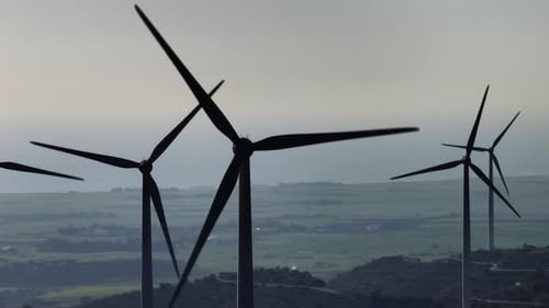 Aerial View of Electricity Production By Wind Generators in a Natural Landscape