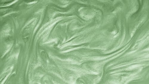 Liquid green motion organic background. Shine glitter fluid metallic color paint.