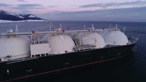 Aerial of Liquified Natural Gas LNG Carrier Moored to a Small Gas Terminal Fuel Crisis Sanctions