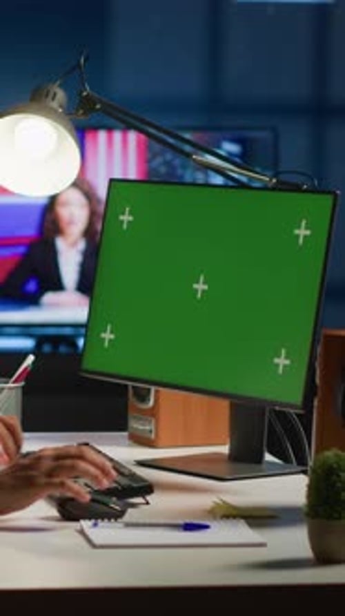 Vertical Video Worker Inputs Data on Mockup Computer