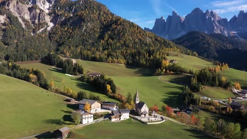 Aerial view of Dolomites mountains and village, Italy.
