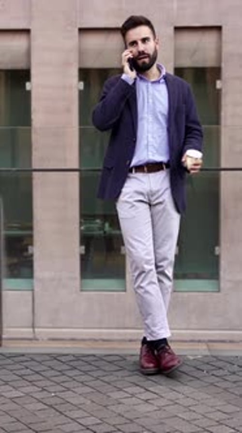 Bearded Man Talking on Phone Outdoors
