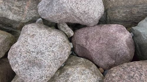 Looking down on pile of big stones, spinning shot