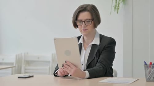 Business Woman Using Tablet for Video Call