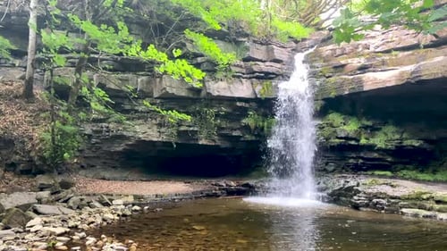 Gibsons Cave waterfall in Teedale, North-East England, UK on a bright summers day. Still Shot