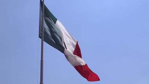 Mexican Flag Waving Against Blue Sky
